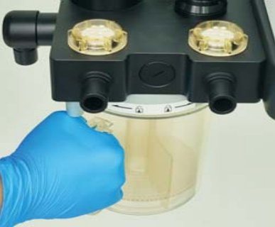 Removing the CO2 absorber canister with one hand